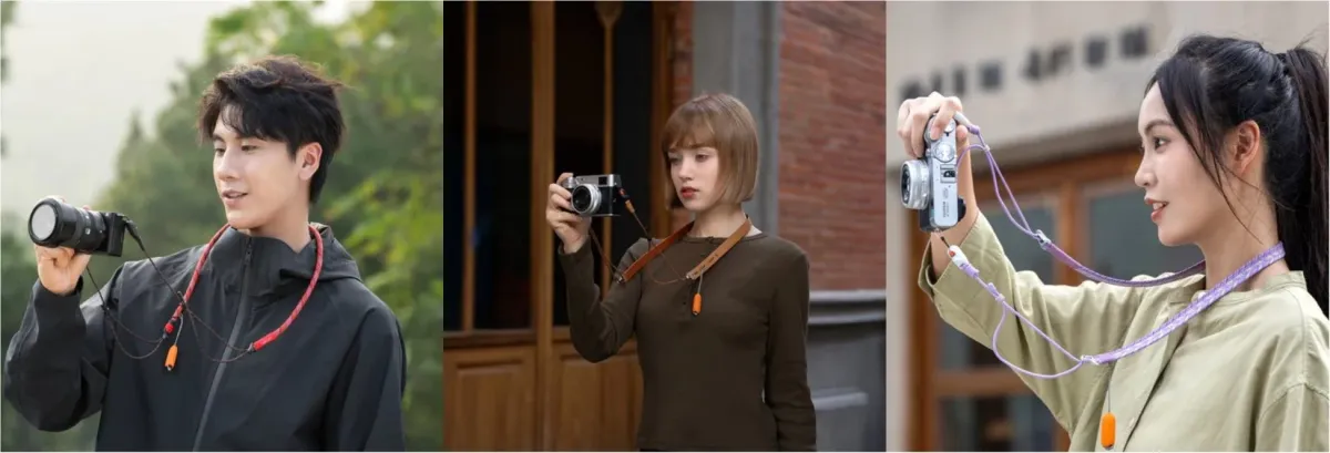 異なる3人の男女が、それぞれのカメラにネックストラップを装着して持っている様子
