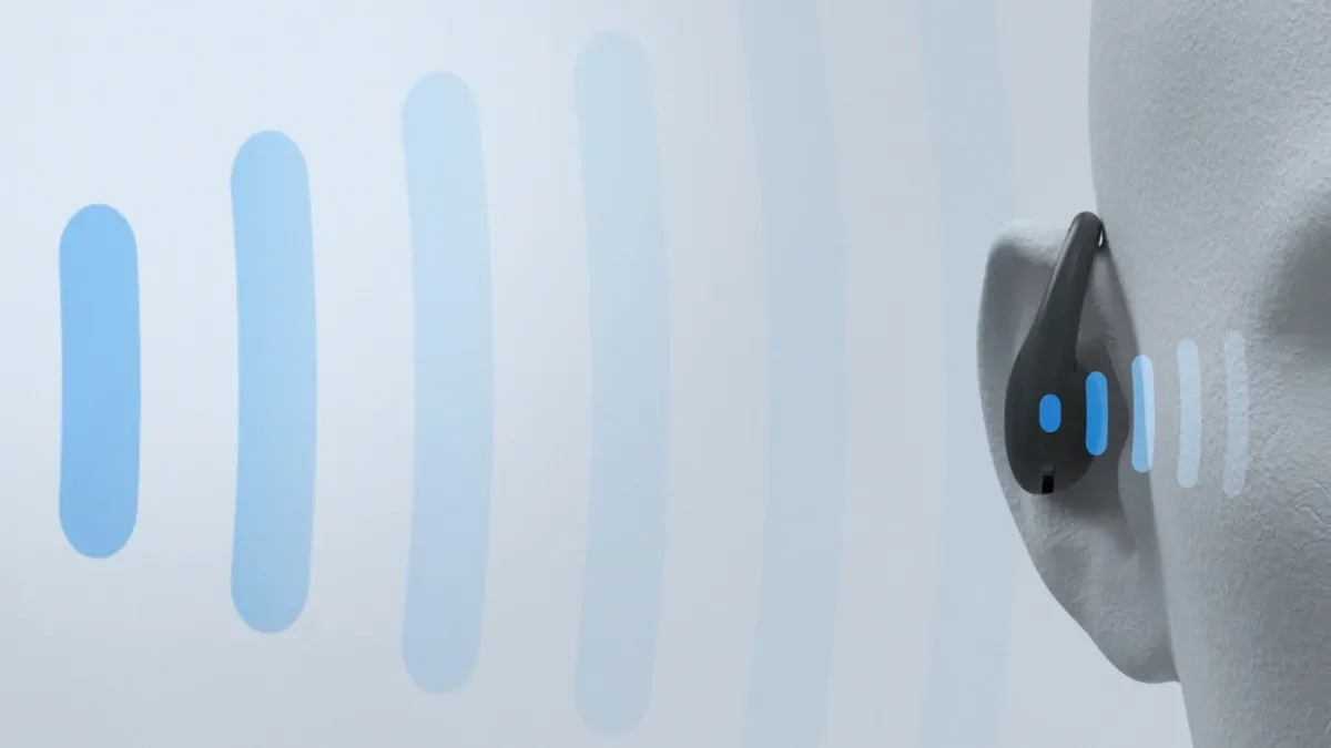 耳に装着されたワイヤレスイヤホンから音波のような青い光が発せられている様子を描いた画像です。聴覚技術やオーディオデバイスを表現しています。