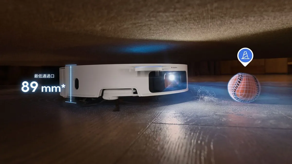 家具の下を掃除する白いロボット掃除機