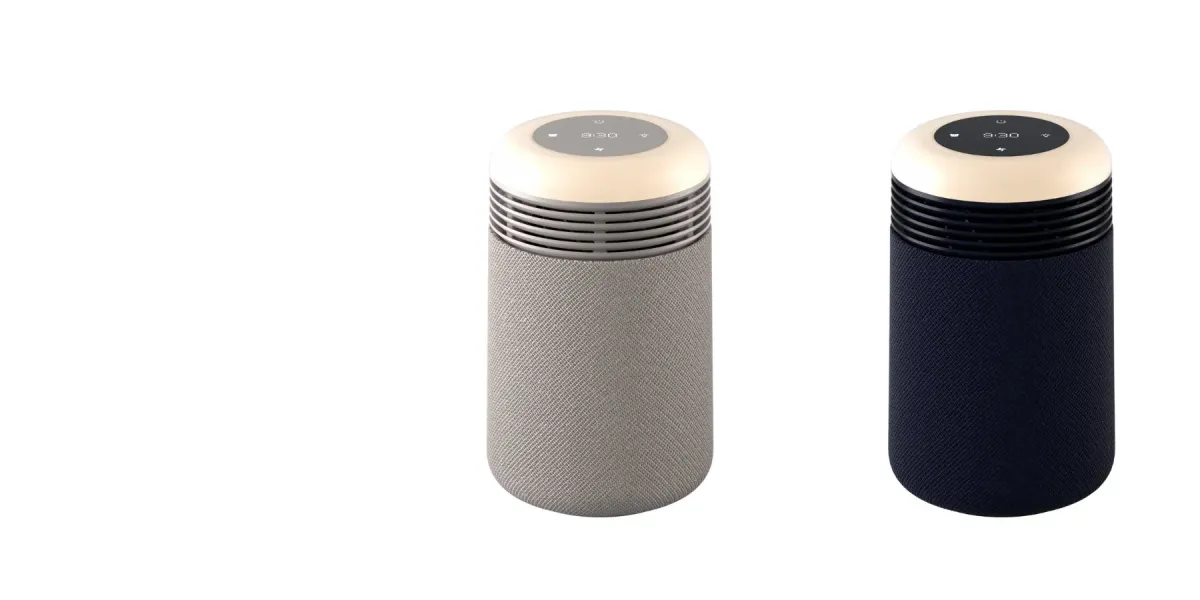 グレーとネイビーのファブリック素材で覆われた円筒形のモダンな電子機器