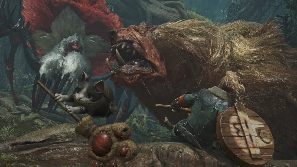 ハンターとオトモアイルーがモンスターと戦闘