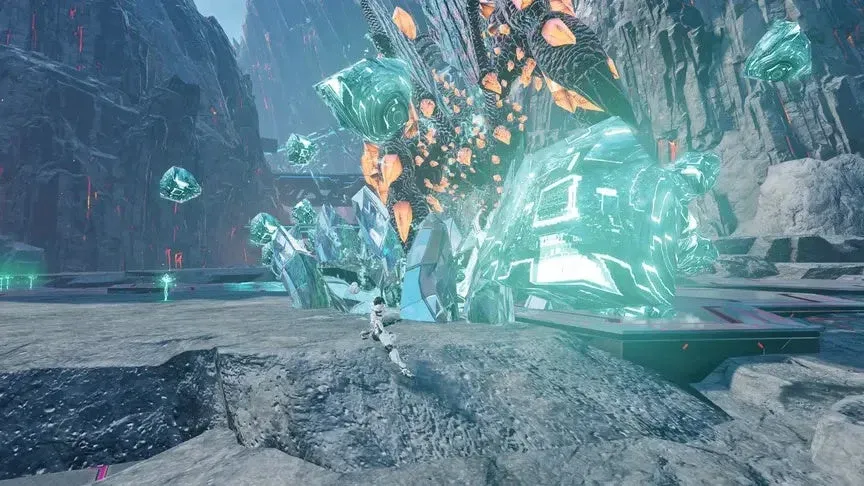 未来的な荒野で巨大な青緑色のクリスタル構造物が砕け散る